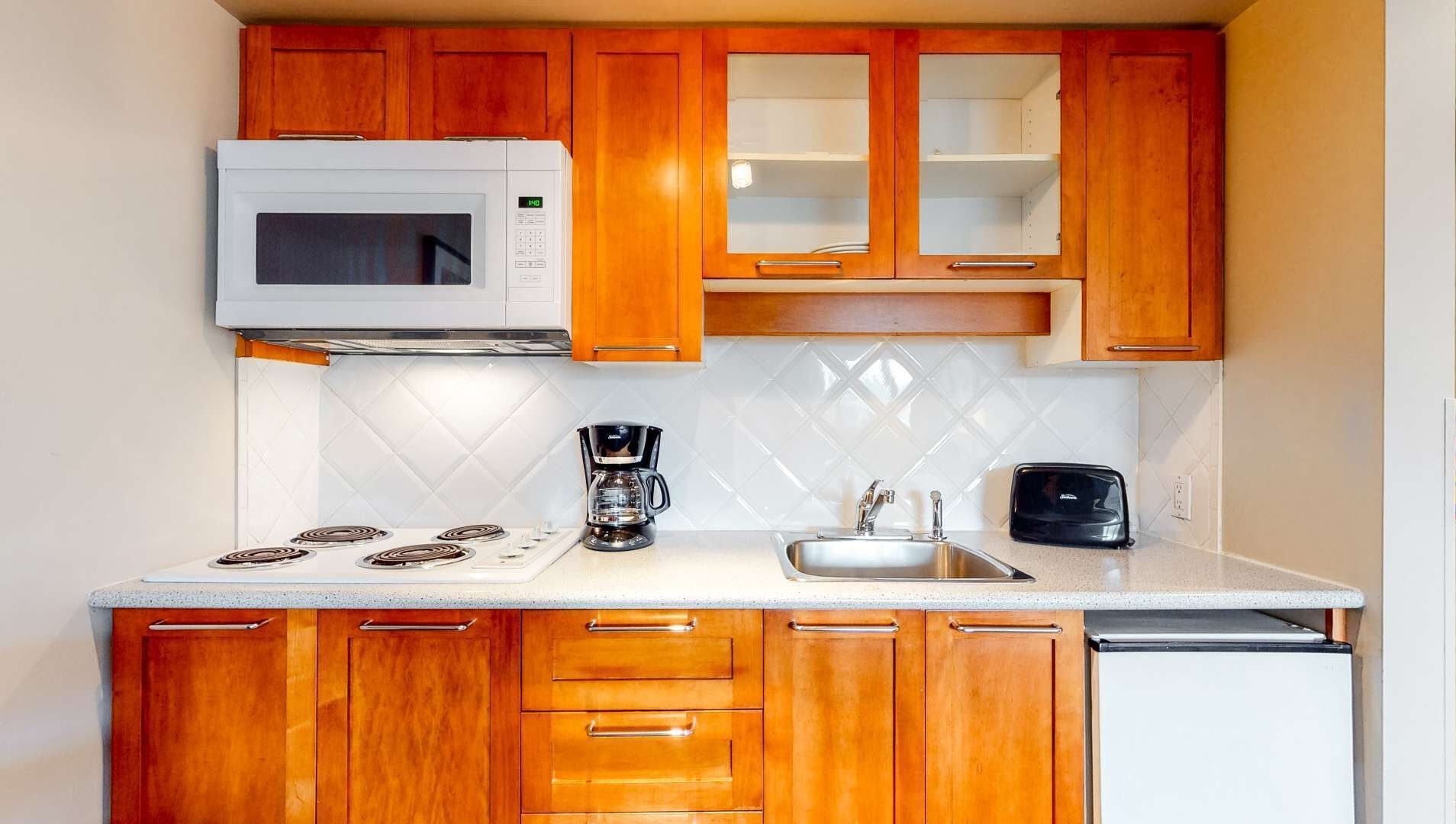 Fridge, microwave, stovetop, coffee/tea maker