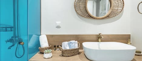 Allegra | Bathroom | Shower, rainfall showerhead, hair dryer, towels
