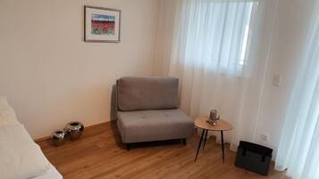 Room, Balcony, Garden View | Living area | 32-inch flat-screen TV with cable channels, TV, heated floors