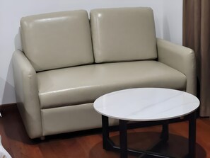 Deluxe Double Room | Living area | 32-inch TV with digital channels