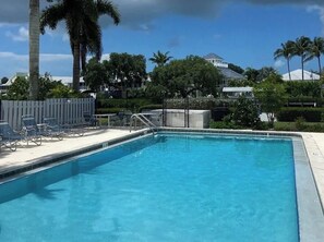 Outdoor pool, a heated pool - Waterfront Condo w/Boat Dock, Kayak, Bikes, Pool & Pickleball-Best Fishing!! (Bokeelia)