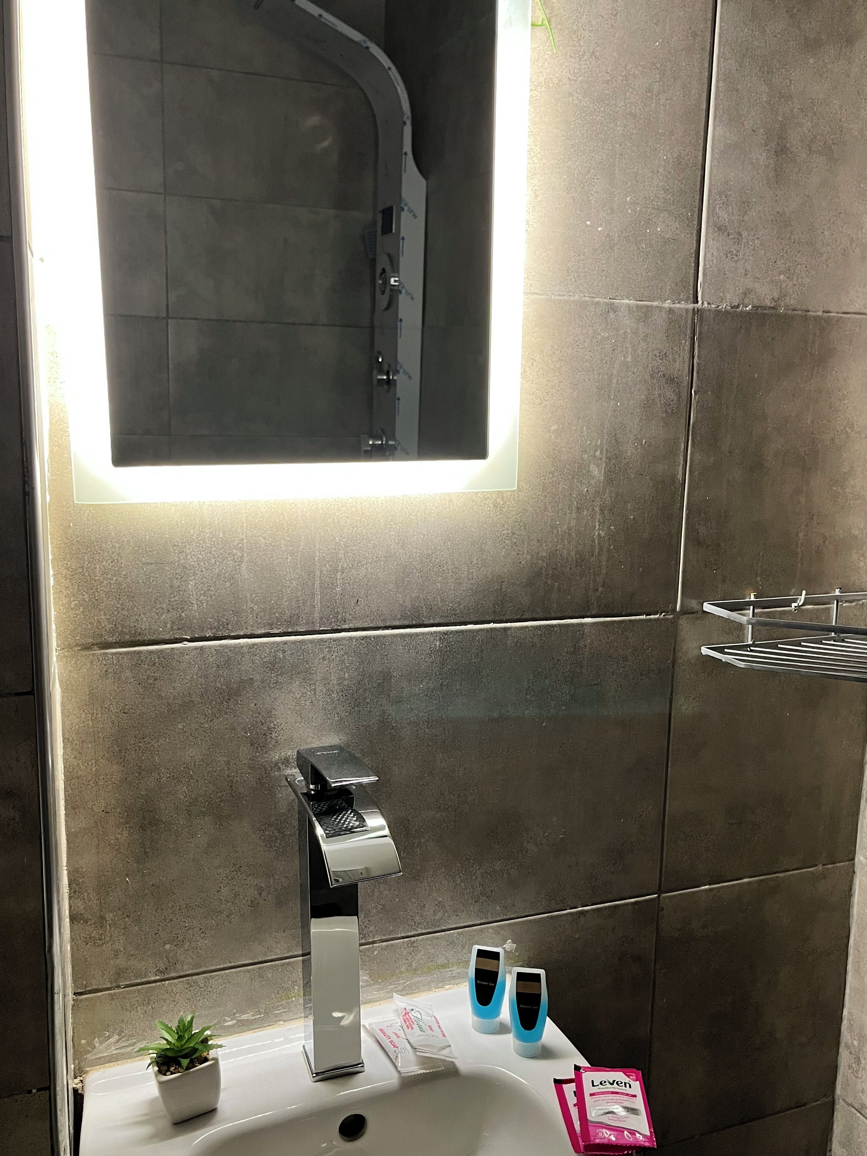 Separate tub and shower, towels, soap, shampoo