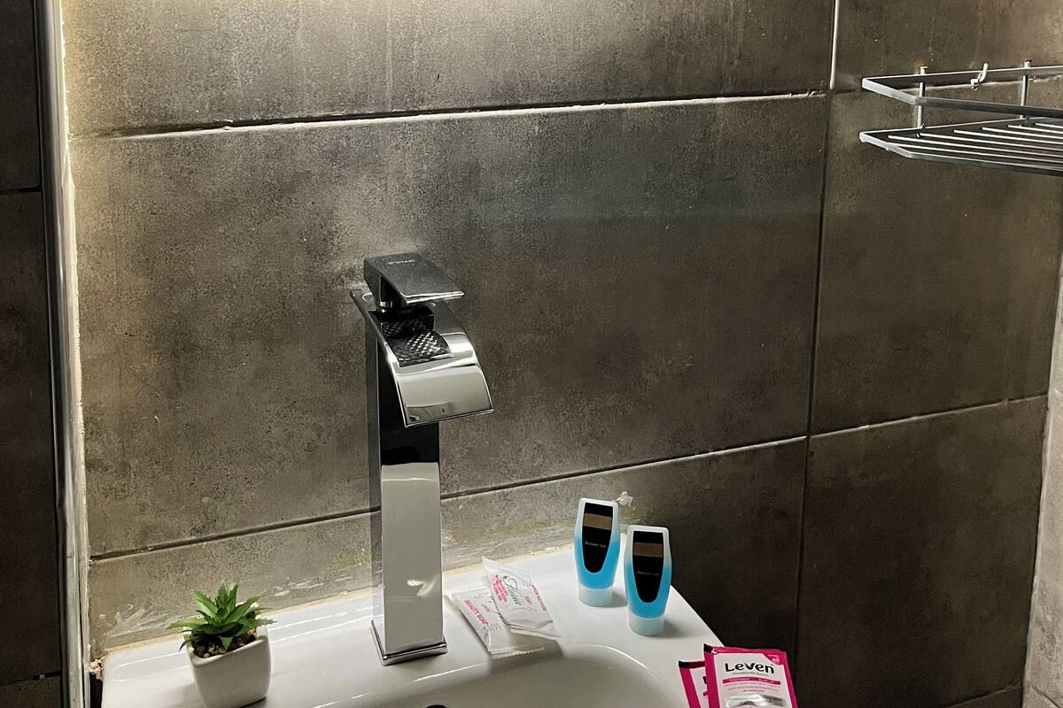 Separate tub and shower, towels, soap, shampoo