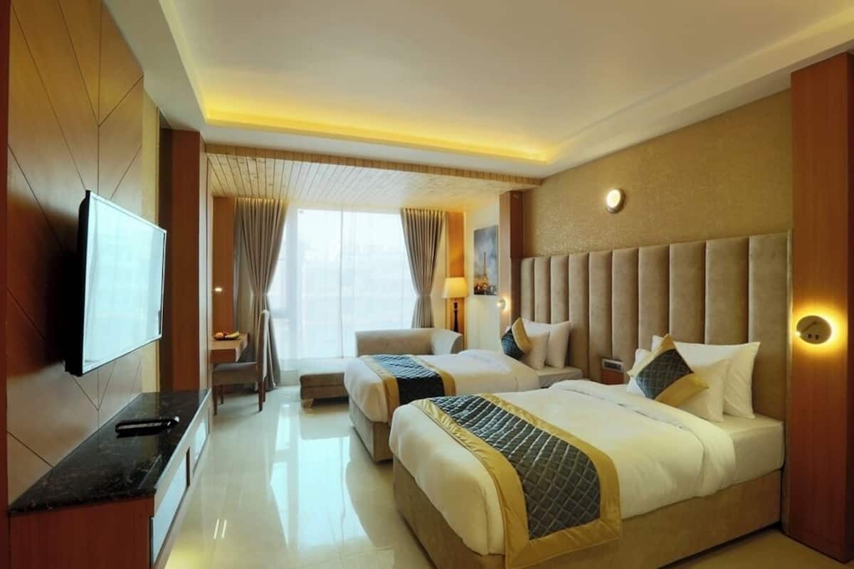 Habitación triple Deluxe | Espacio para trabajar con laptop y wifi gratis