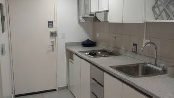 Fridge, microwave, stovetop, coffee/tea maker