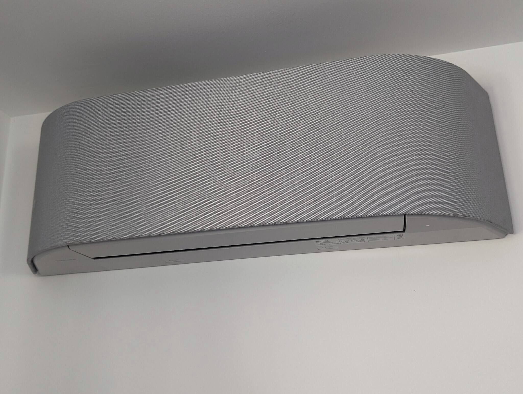 A gray, textured wall panel with a flat surface and a recessed section at the bottom.