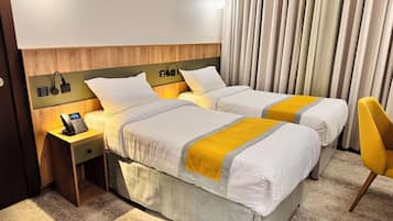 Twin Room, City View | In-room safe, desk, blackout drapes, iron/ironing board