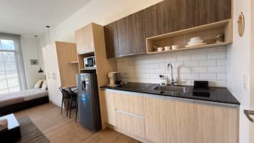 Fridge, microwave, stovetop, coffee/tea maker