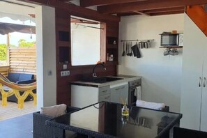 Oven, stovetop, toaster, dining tables