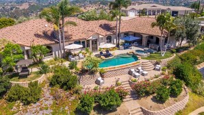 A residential property with a swimming pool, outdoor seating, and a landscaped garden. - Luxury Wine Country Casita with Extraordinary Ridgetop Views Extensive Amenities (Fallbrook)