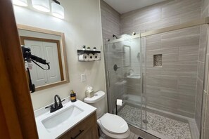 Shower, hair dryer, towels, soap
