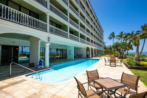 A hotel with a swimming pool, outdoor seating, and a view of the ocean. - New Listing - Lahaina Shores 317, Beautiful Beachfront Location (Lahaina)