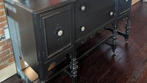 A dark wooden dresser with drawers and a coffee maker on top. - Historic Luxury on Main Street in Spring Hill (Spring Hill)