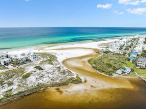 An aerial view of a coastal area with a beach, a river-like water body, and residential buildings. - 🏖️ Coastal Decor | Pool | Bikes | Ping-Pong Table 🏓 (Seagrove)