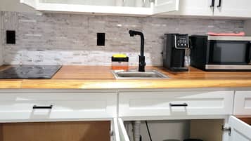 Microwave, stovetop, coffee/tea maker, toaster