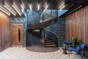 Interior - Workspace & Gym with Skyline View : StayCozy (Croydon)