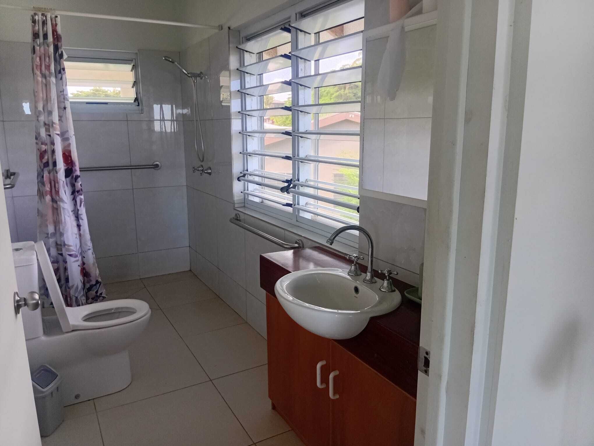 Shower, towels, soap, toilet paper