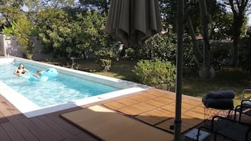 Outdoor pool, open 9:00 AM to 6:00 PM, pool umbrellas, pool loungers