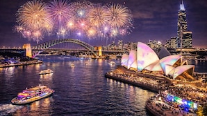A nighttime view of Sydney's Sydney Opera House and Harbour Bridge, with fireworks in the background. - Luxury Spacious 3BR Family Home Walk To Harbour Bridge/ Opera House& CBD (Millers Point)