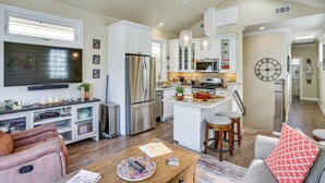 A modern kitchen with white cabinets, stainless steel appliances, and pendant lighting. - Walk to Bay & Pleasure Pier! Catalina Island Stay (Avalon)