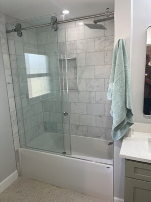 Shower, towels, soap, toilet paper