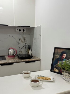 Fridge, microwave, stovetop, cookware/dishes/utensils - Cornerstone Suites (Aizawl)