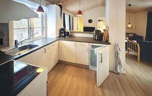 Fridge, stovetop, dishwasher, coffee/tea maker