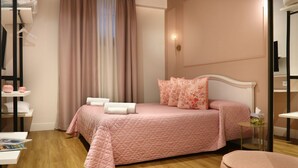 A neatly arranged bedroom with a bed, a bedside table, a chair, and a window with curtains. - Address: Calle del Forno, 3776 - CastelloGoogle maps' position : https://maps.app.goo.gl/8ZB3pERQmRtSMLuj6The apartment is located on the ground floor, completely restored and finely furnished, consisting of two bedrooms (one double and one with two sing (Venezia)