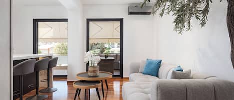 Family Suite, Balcony | Living area | 45-inch Smart TV with satellite channels, Netflix, streaming services