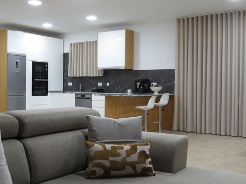 MANECAS HOUSE CREATIVE offers an outdoor swimming pool and barbecue area.