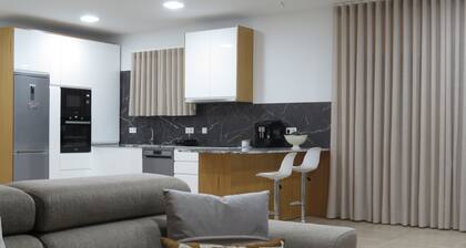 MANECAS HOUSE CREATIVE offers an outdoor swimming pool and barbecue area.