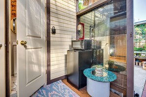 A compact kitchen with a refrigerator, a microwave, and a small table with potted plants. - Solo 'cultural Retreat' in San Gabriel Valley! (San Gabriel)