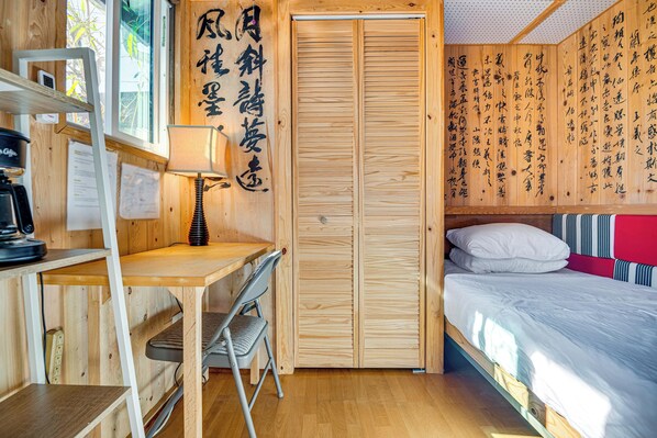 A compact room with a wooden desk, a chair, a bed with white bedding, and a wardrobe with sliding doors. - Solo 'cultural Retreat' in San Gabriel Valley! (San Gabriel)