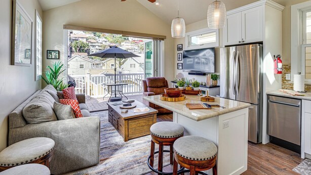 A modern kitchen with a central island, white cabinetry, stainless steel appliances, and a ceiling fan. - Walk to Bay & Pleasure Pier! Catalina Island Stay (Avalon)