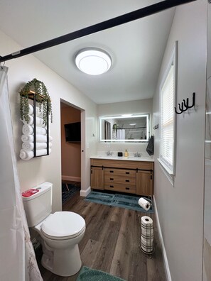 Shower, hair dryer, towels, soap