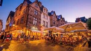 A historic building with a traditional European architectural style, featuring timber framing and a stone facade. - Spacious 3-bedroom apartment in Tours Nord near the tramway (Tours)
