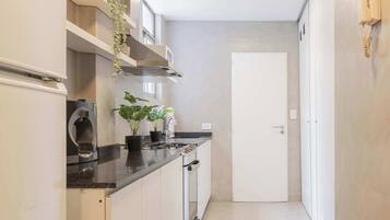 Microwave, coffee/tea maker, toaster, cookware/dishes/utensils