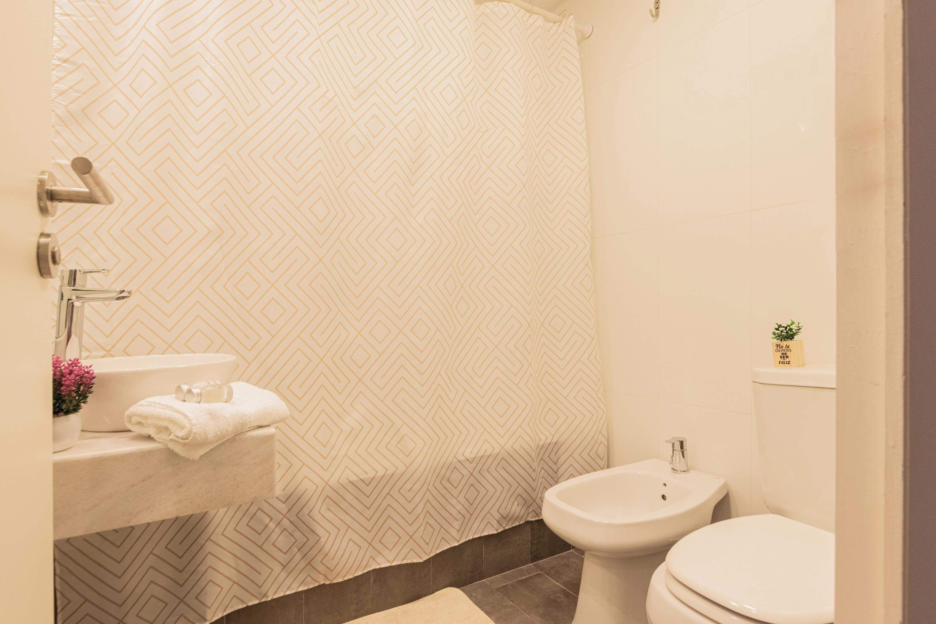 Shower, hair dryer, towels, shampoo