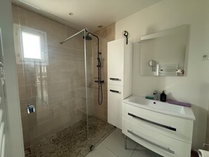 Shower, hair dryer, towels, toilet paper