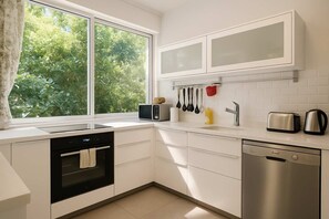 Fridge, microwave, oven, stovetop - Charm & Green 1BR TLV - Beachside | By SweetyGuest (Tel Aviv-Yafo)