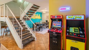 A home interior with a staircase, arcade games, and a neon 'GAME ON' sign. - Walk to Old Town! Pool, Arcade & Mini Golf - 6 beds (Scottsdale)