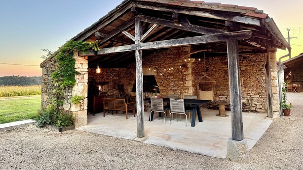 A rustic stone building with a wooden roof and a covered patio area. - Where authenticity meets the comforts of today.Includes covered private terrace (Blanquefort-sur-Briolance)