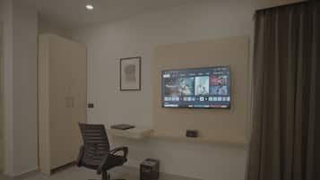 Premium Room | Living area | 32-inch flat-screen TV with digital channels