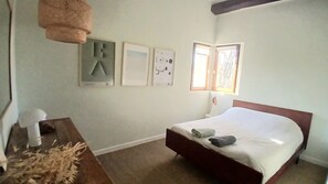 A bedroom with a bed, a desk, and a hanging lamp. There are framed pictures on the wall. - Character house, between Aix-en-Provence and the Lubéron (Saint-Cannat)