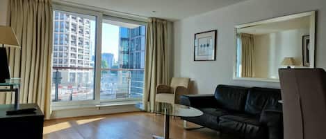 Standard Apartment, Balcony, River View | Living area | 40-inch Smart TV with digital channels, Netflix, heated floors