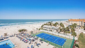 A beachside hotel with a tennis court, pool, and ocean views. - Gulf Coast Bliss Awaits - Reef Club 505 (Indian Rocks Beach)