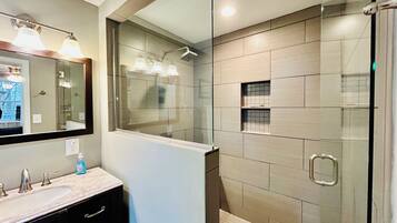 Shower, hair dryer, towels, toilet paper