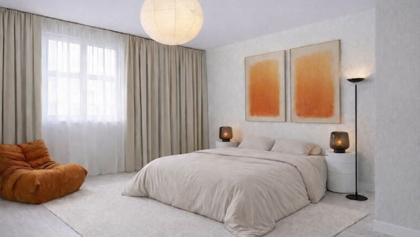 A modern bedroom with a large bed, a hanging light fixture, two wall-mounted lamps, and a bean bag chair.
