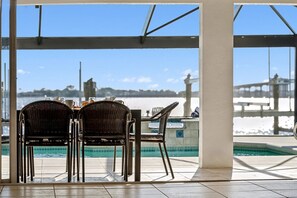 Outdoor dining - Villa Riverside – Luxury Riverfront Home w/ Dock, 2 Boat Lifts, Heated Pool & Whirlpool (Cape Coral)