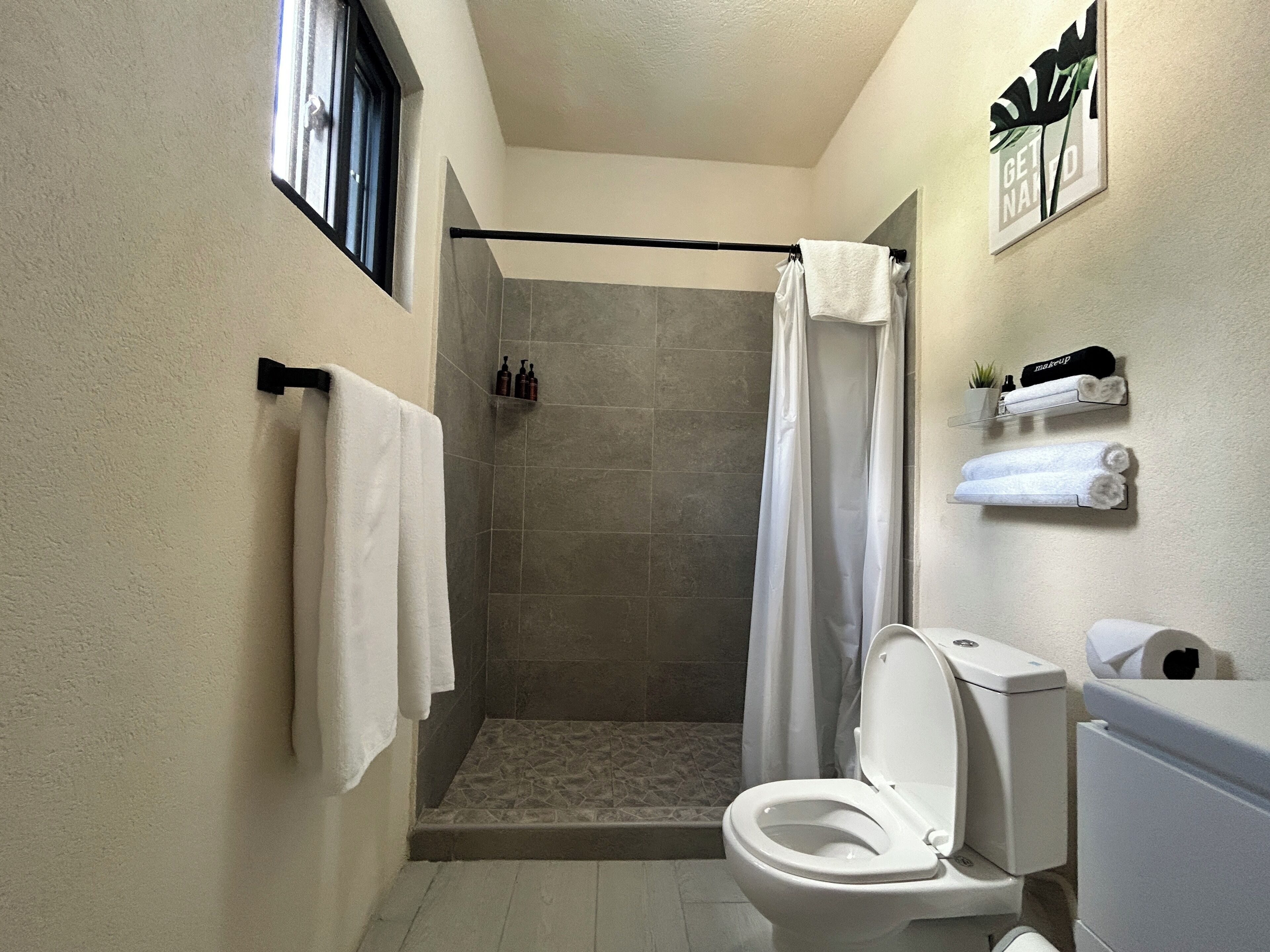 Shower, hair dryer, towels, soap